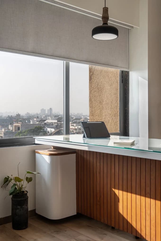 Window-side desk at the clinic overlooking Ahmedabad